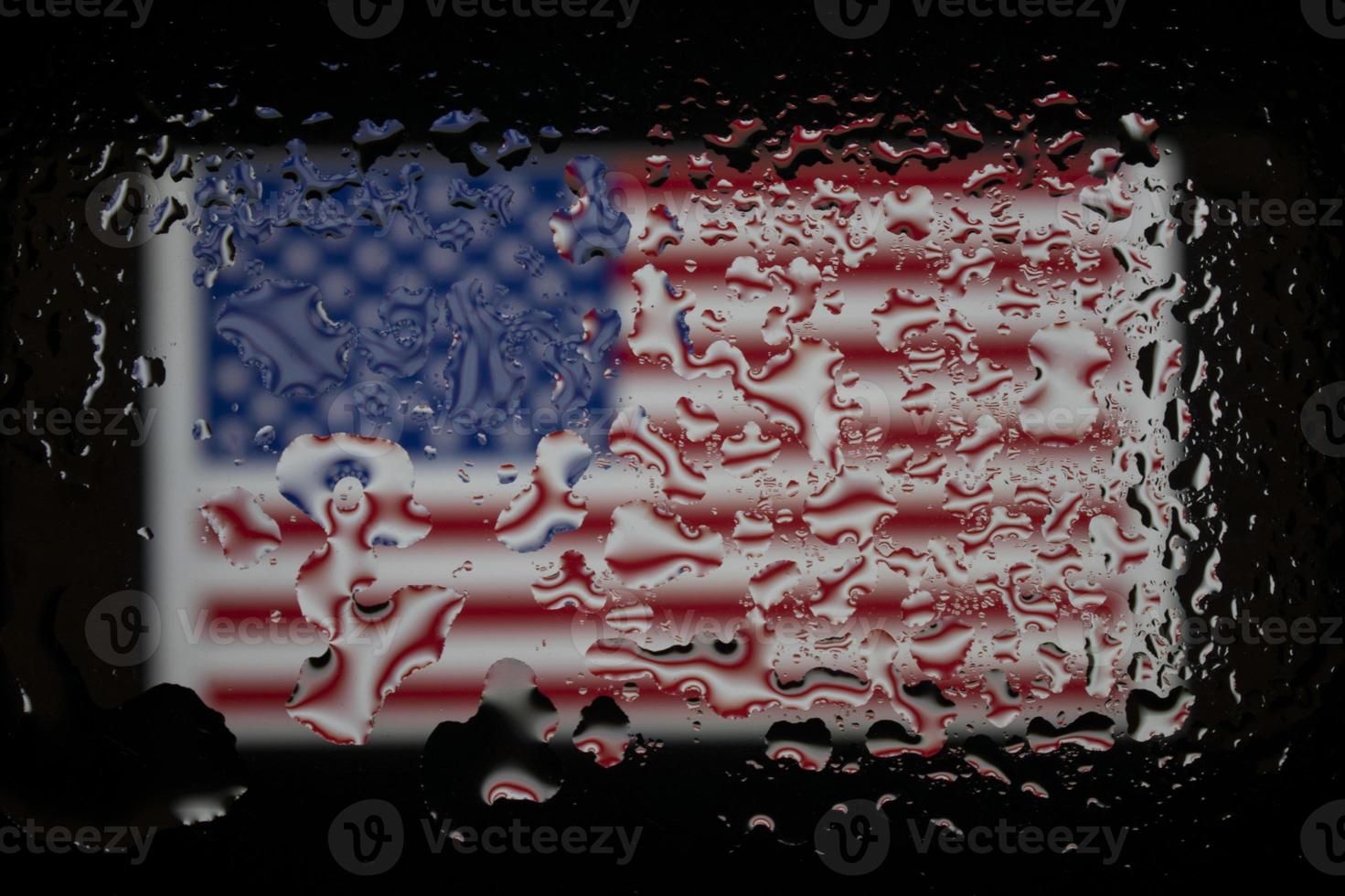 Abstract texture. Water drops on glass with USA flag background photo