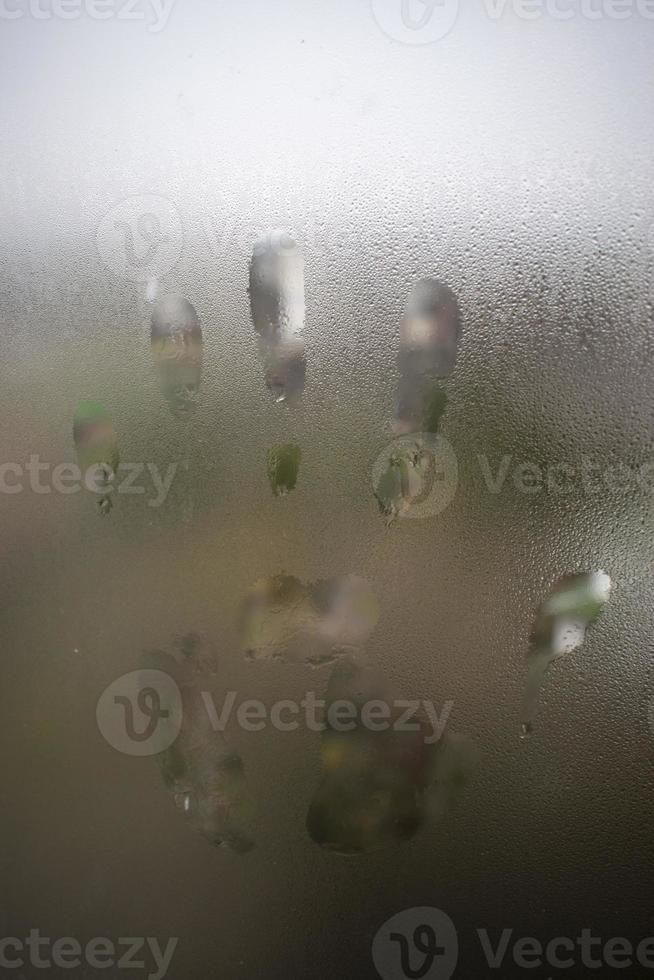 Hand trace on glass photo
