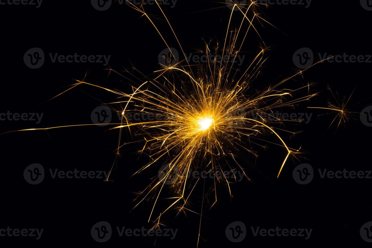 Sparkler on a black background.Close-up of burning sparkler.Fireworks in flame on black background.Christmas sparkler. photo