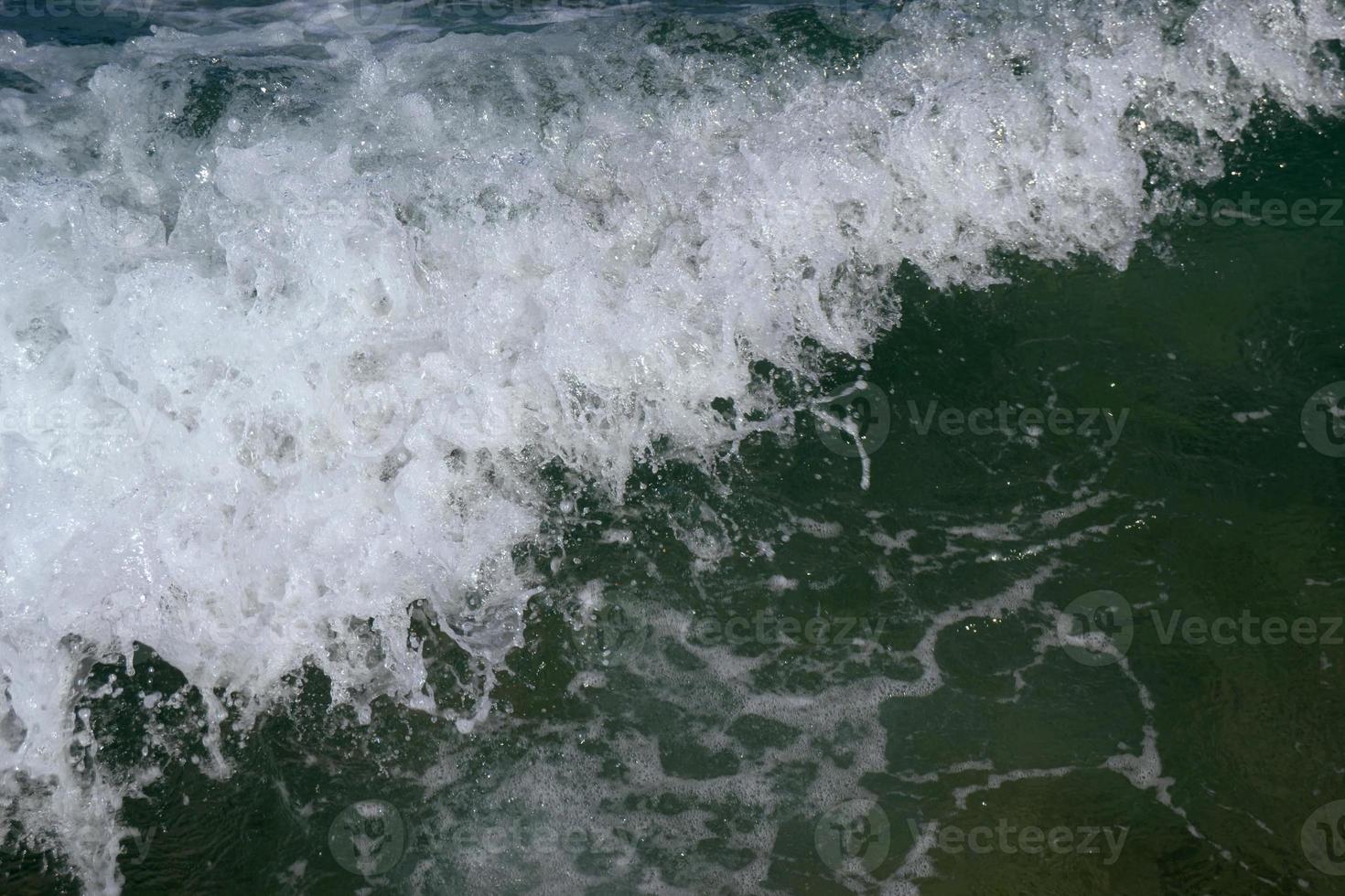 Texture of a foamy wave photo