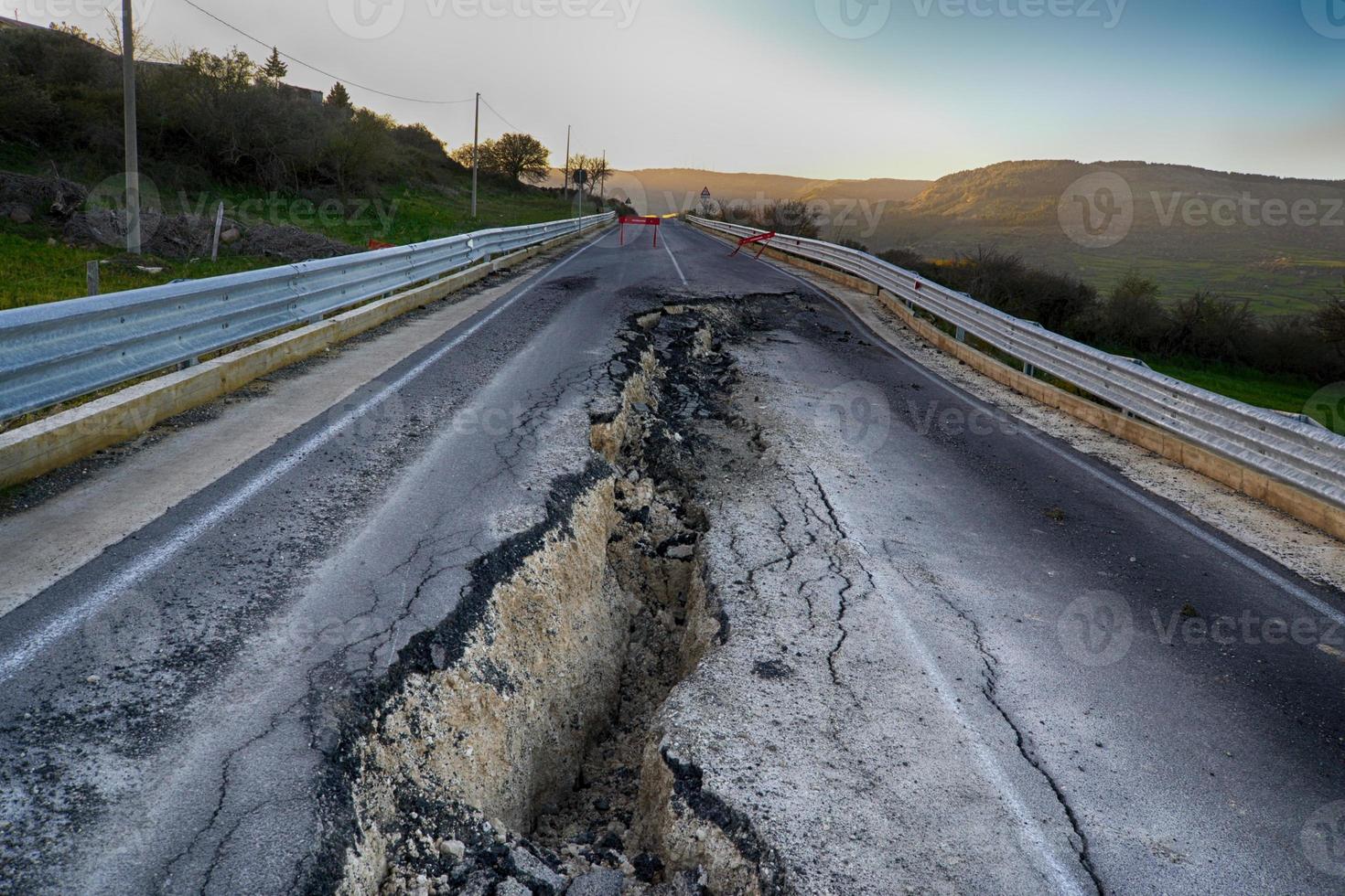 Asphalt road destroyed by the landslide photo
