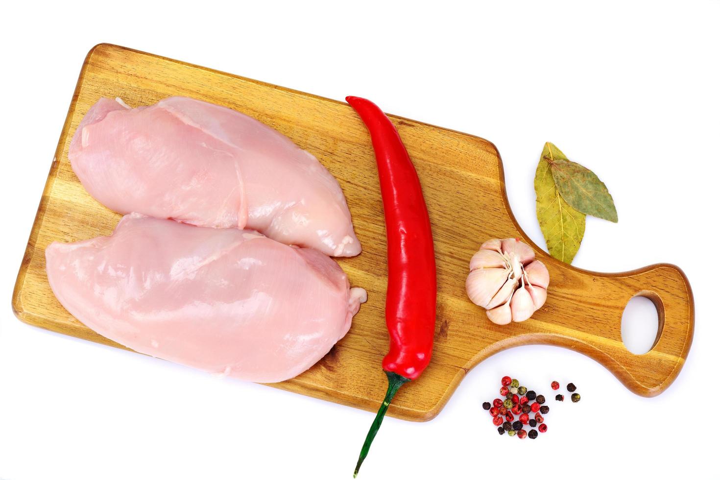 Raw Chicken. Breast. Isolated on White. photo