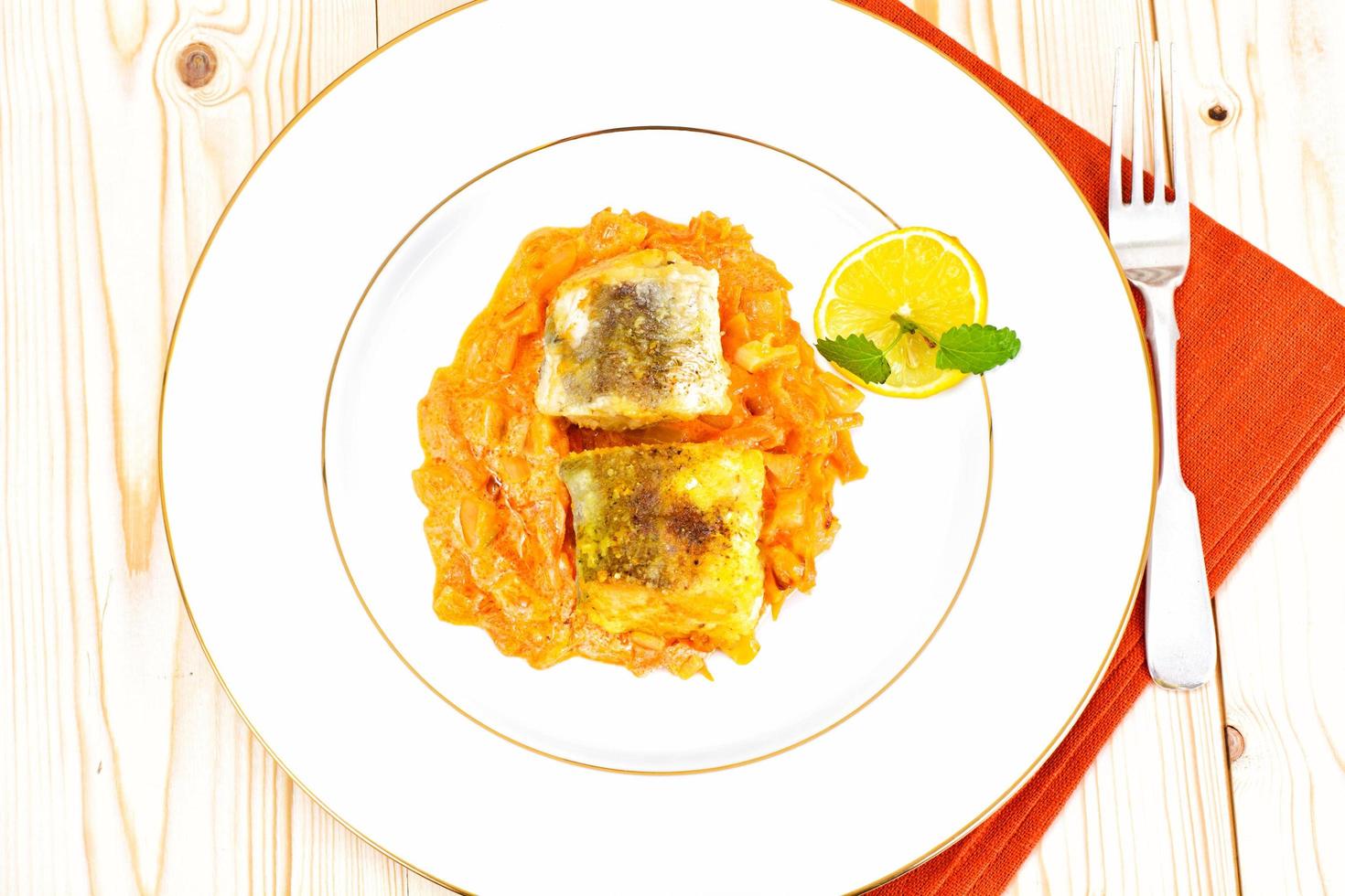 Fish in Greek with Onion and Carrot photo