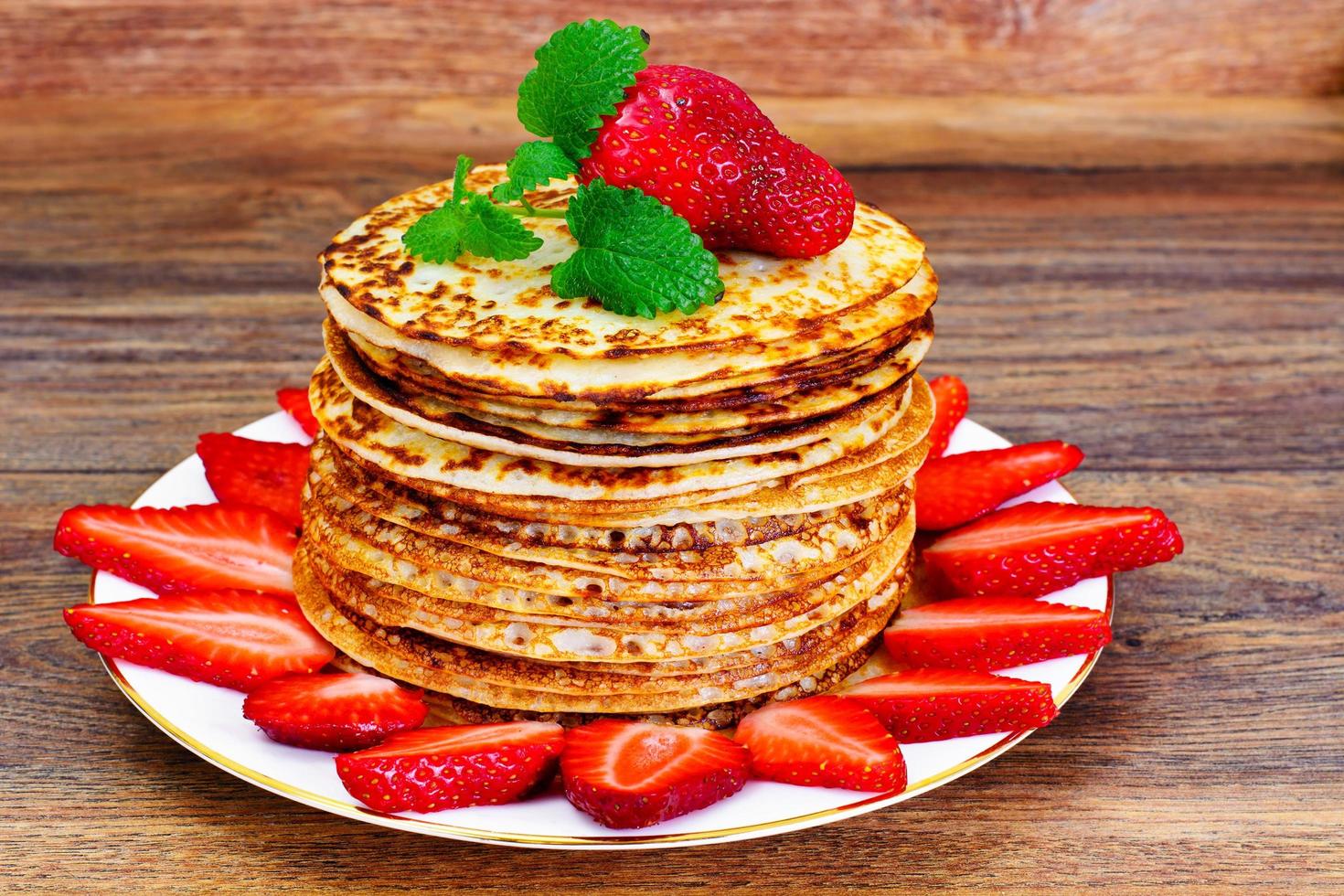 Tasty Pancakes Stack with Strawberry photo