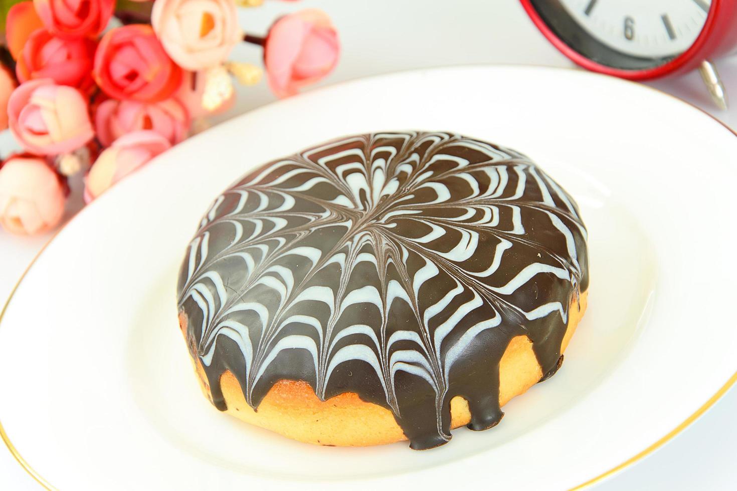 Cake with chocolate on a plate. photo