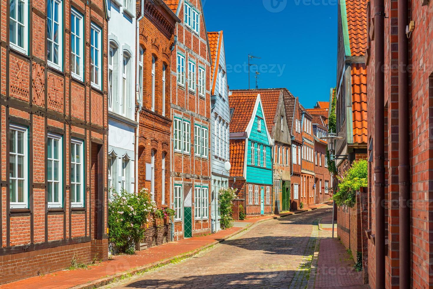 View of a typical German street with brick and half-timbered houses photo