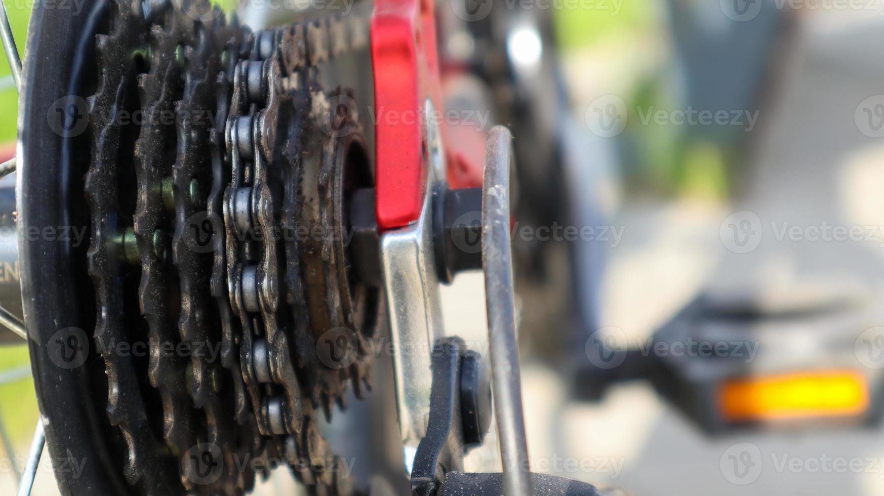 Close-up of a rear set of gear shifting sprockets on the rear wheel of a modern mountain bike with chain. Bicycle repair. photo