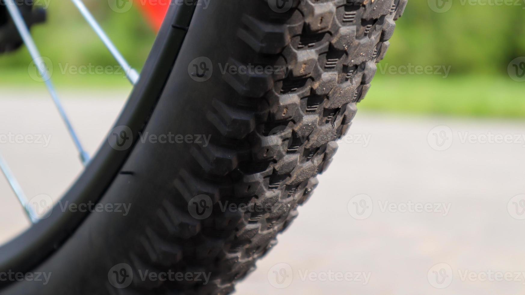 Mountain bike wheel and mud tire close. photo