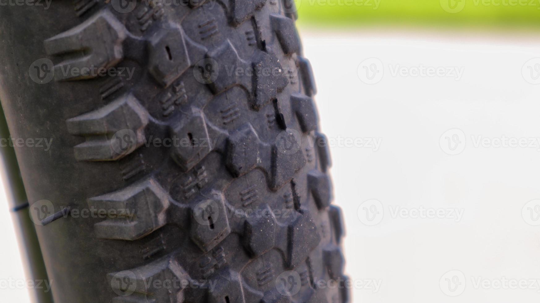 Mountain bike wheel and mud tire close. photo