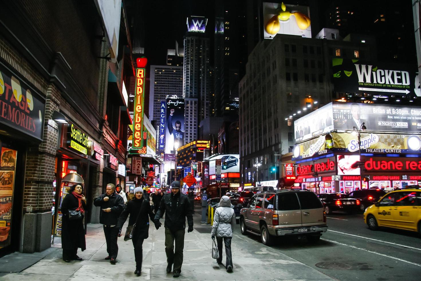 NEW YORK, USA. February 2009. people walking around times square in manhattan at night. photo