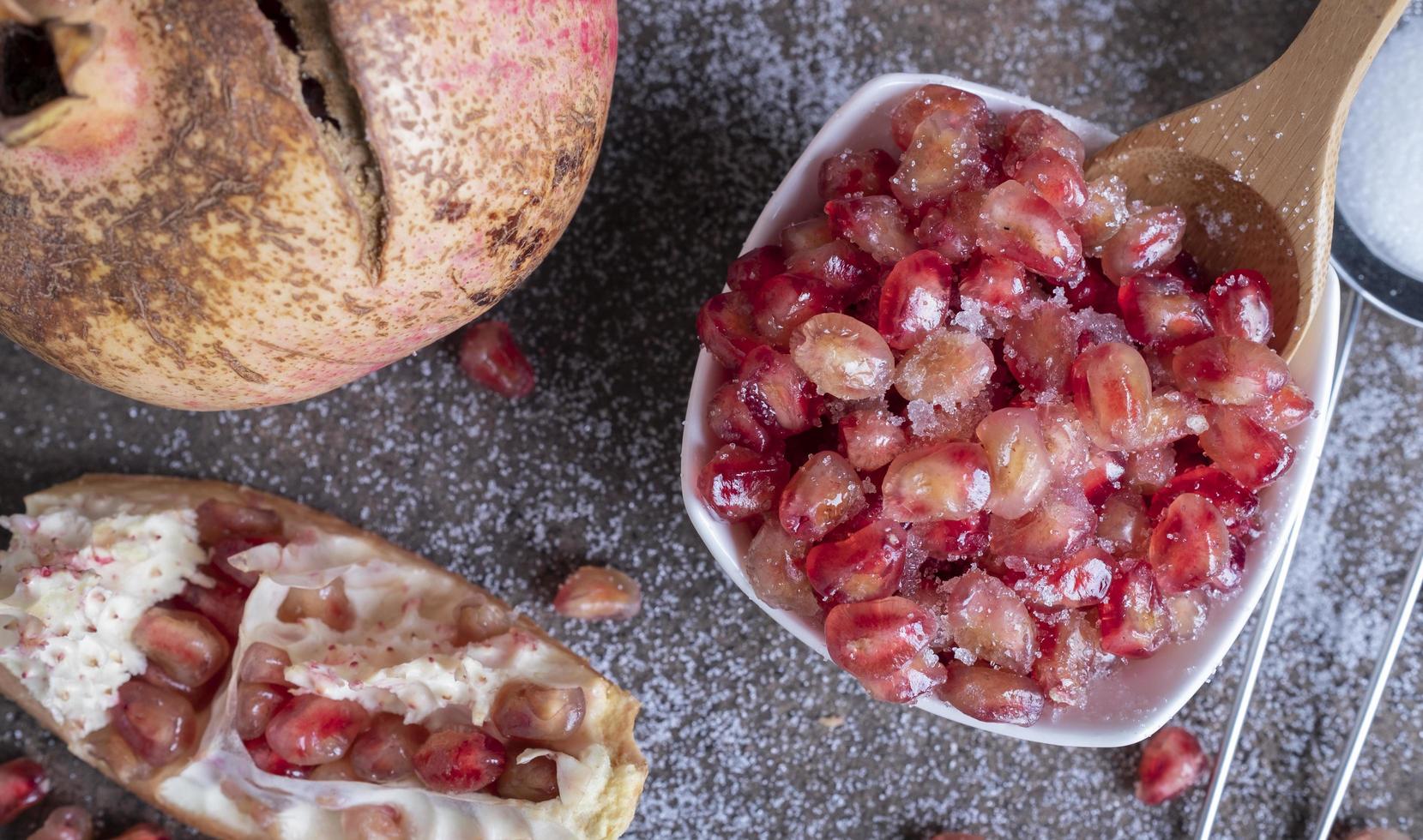 cup with fruit sprinkled with pomegranate fruit sugar photo
