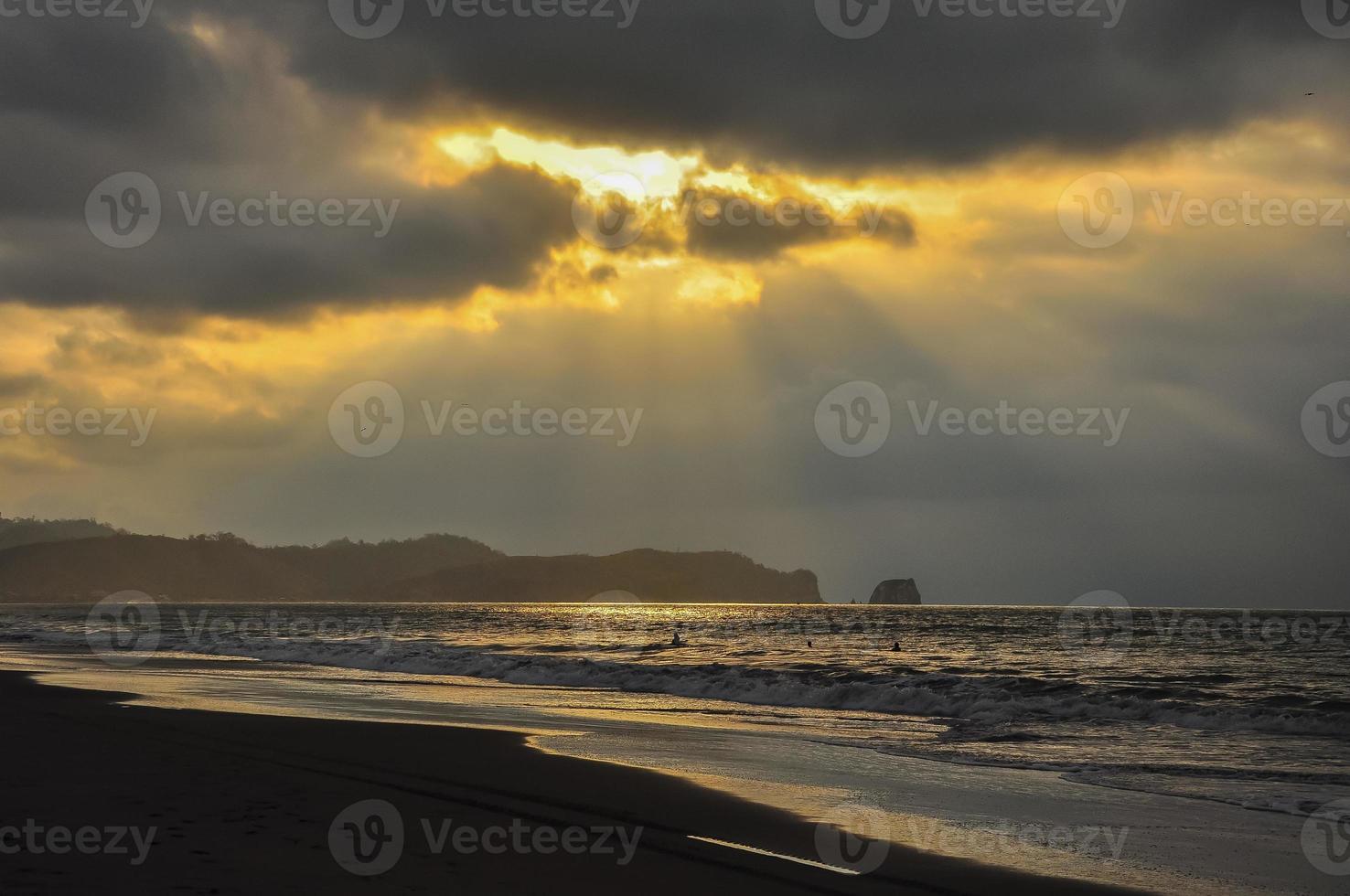 A stormy sunset on teh beach photo