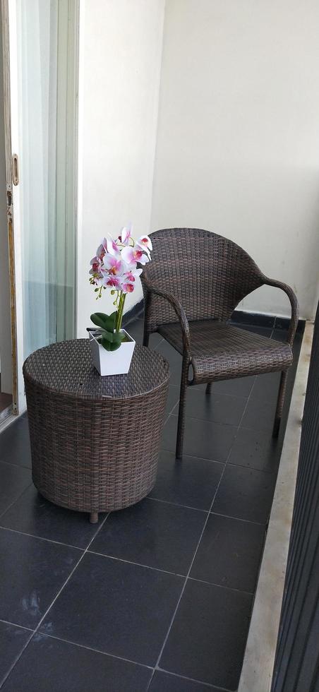 terrace courtyard balcony with rattan and orchid table and chairs photo