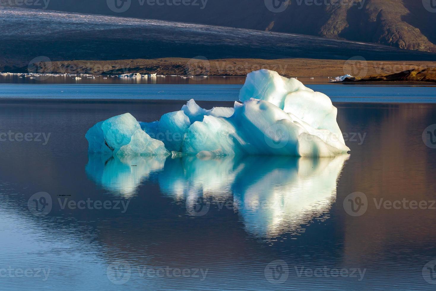 Jokulsarlon lagoon with blue sky floating iceberg photo