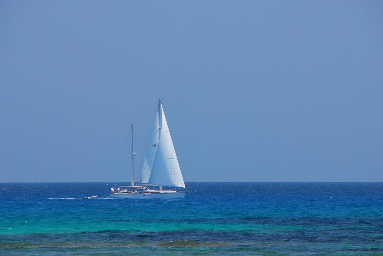 sailing ship at the blue sea photo