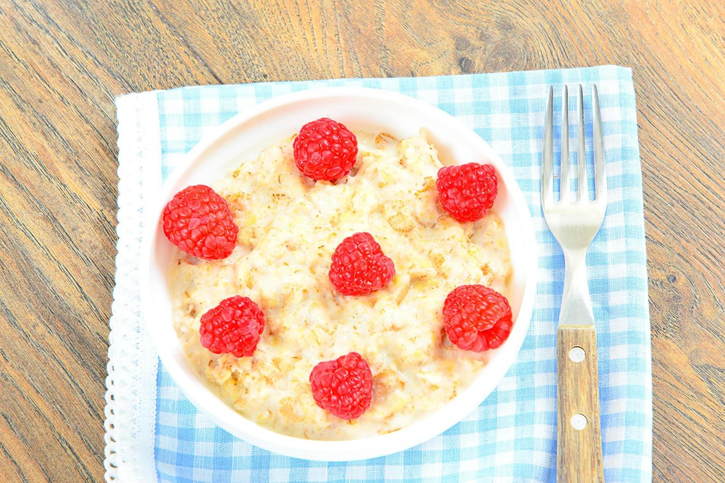 Oatmeal with Raspberries. Classic Breakfast photo