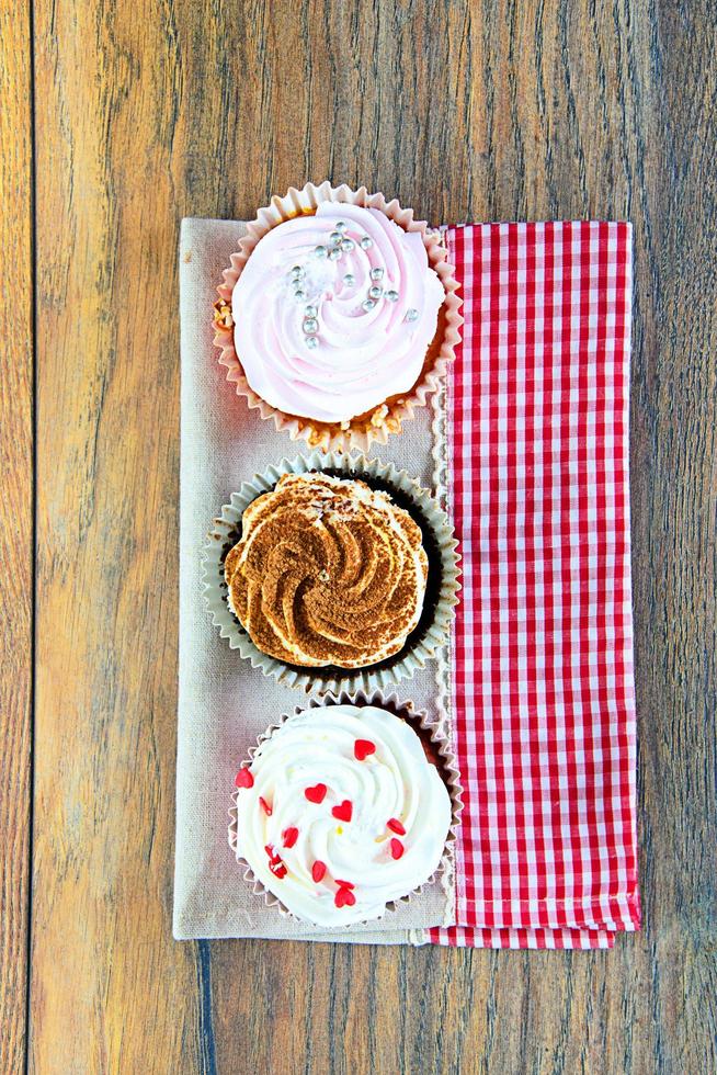 Cake with Cream, Cupcake on Wood photo