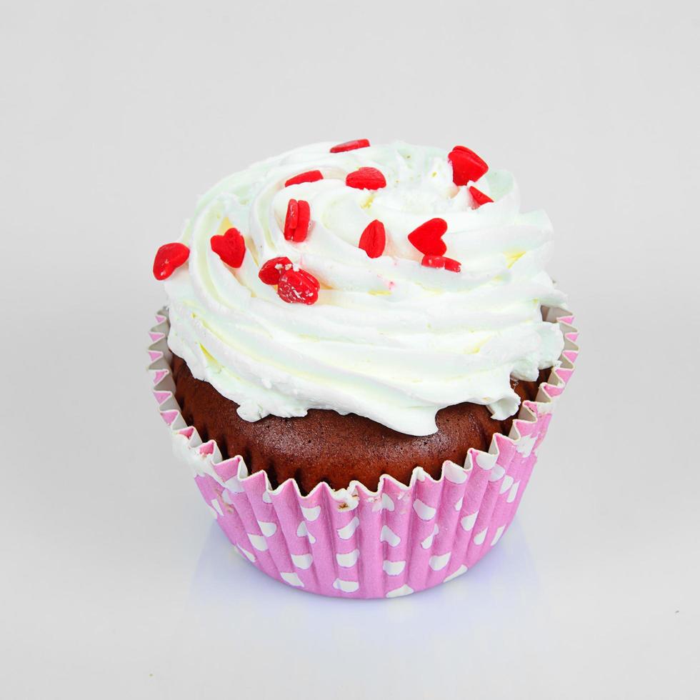 Cake with Cream, Cupcake on Light Background photo