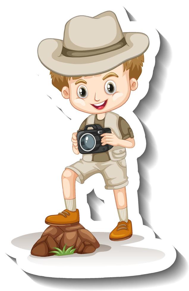 una plantilla de pegatina con un niño en traje de safari sosteniendo un personaje de dibujos animados de cámara vector