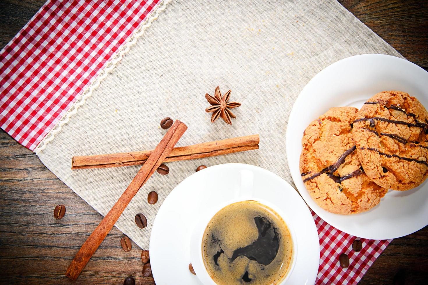 Coffee with Bakery on Woody Retro Background. photo