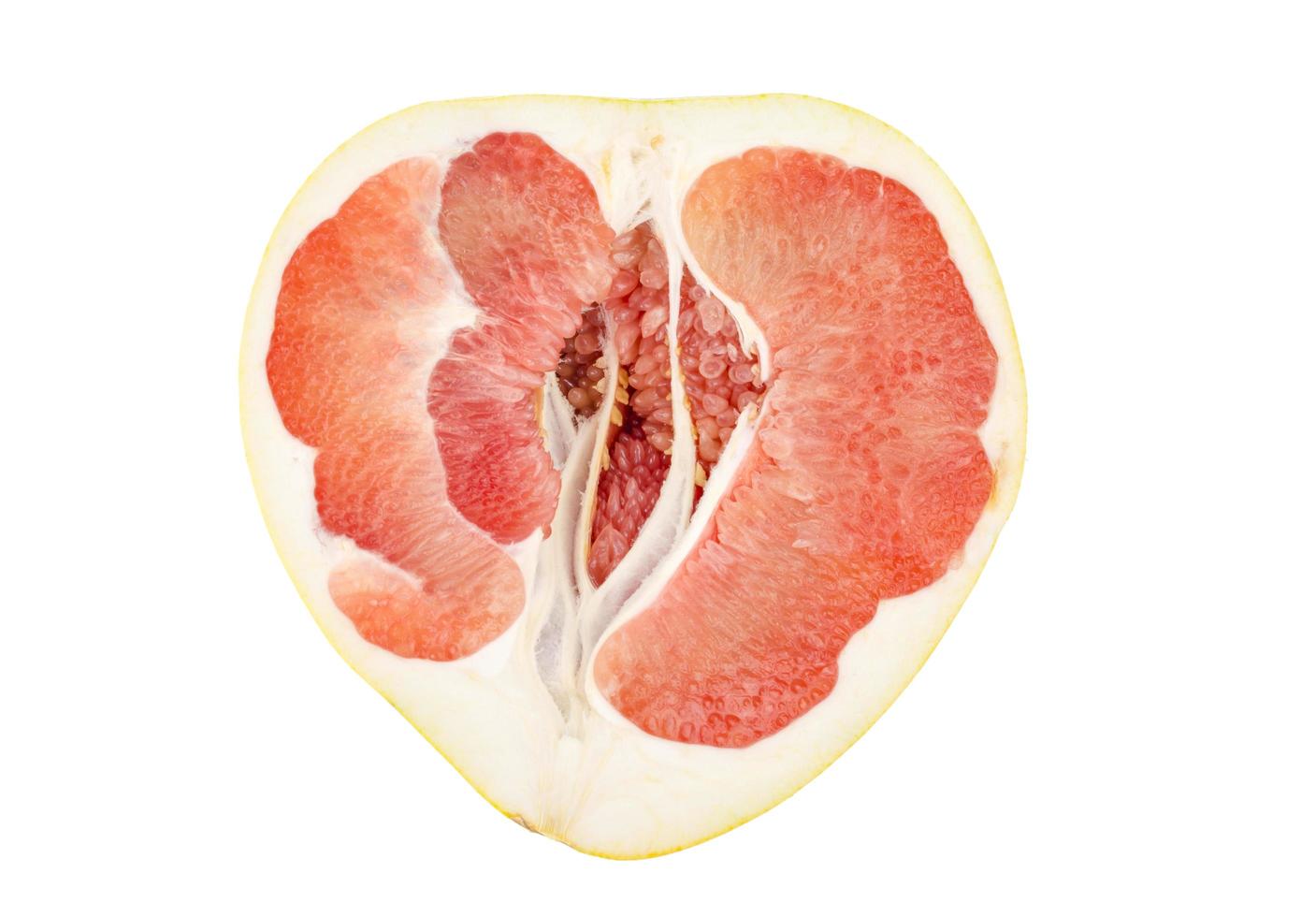 Halves of red chinese sliced pamelo on white background. photo