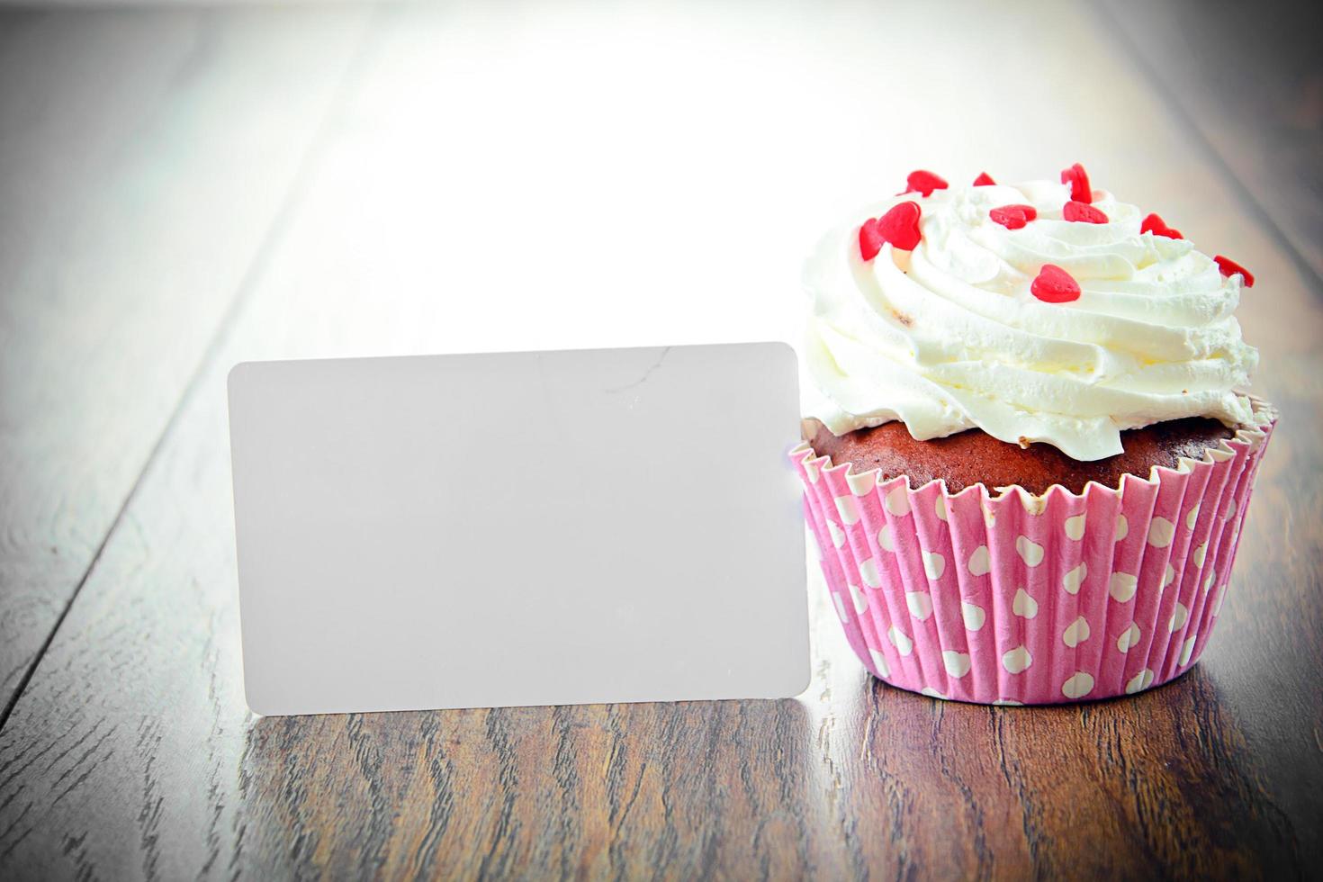 Cake with Cream, Cupcake on Woody Background photo