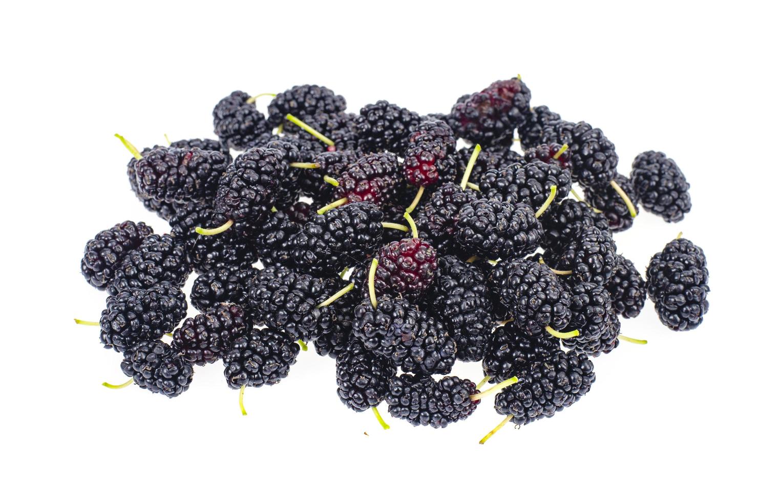 Bunch of sweet black ripe garden mulberry berries isolated on white. photo