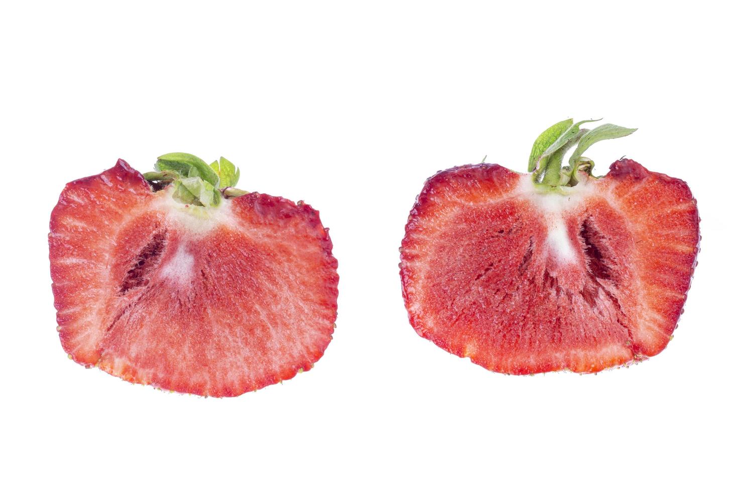 One big red ripe sliced strawberry isolated on white background photo