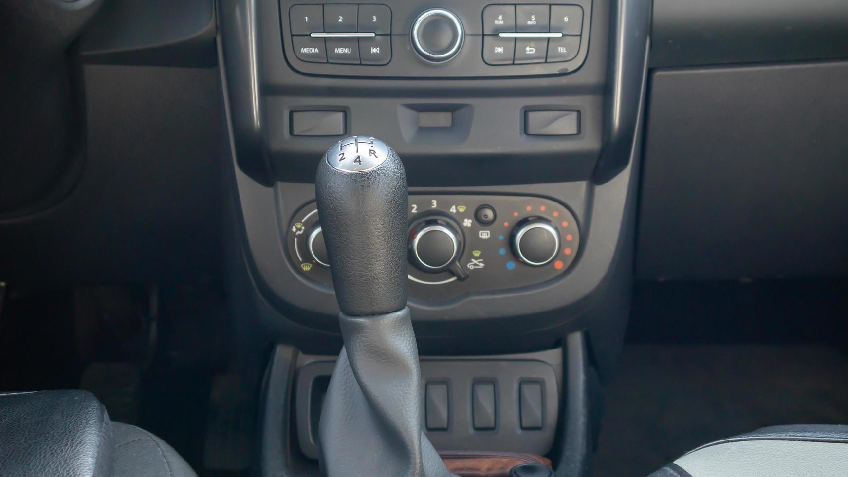 Knob for selecting the gear of a manual gearbox. Manual transmission knob in the car. Close-up of the gear shift lever. Vehicle interior. Detail of the car. photo