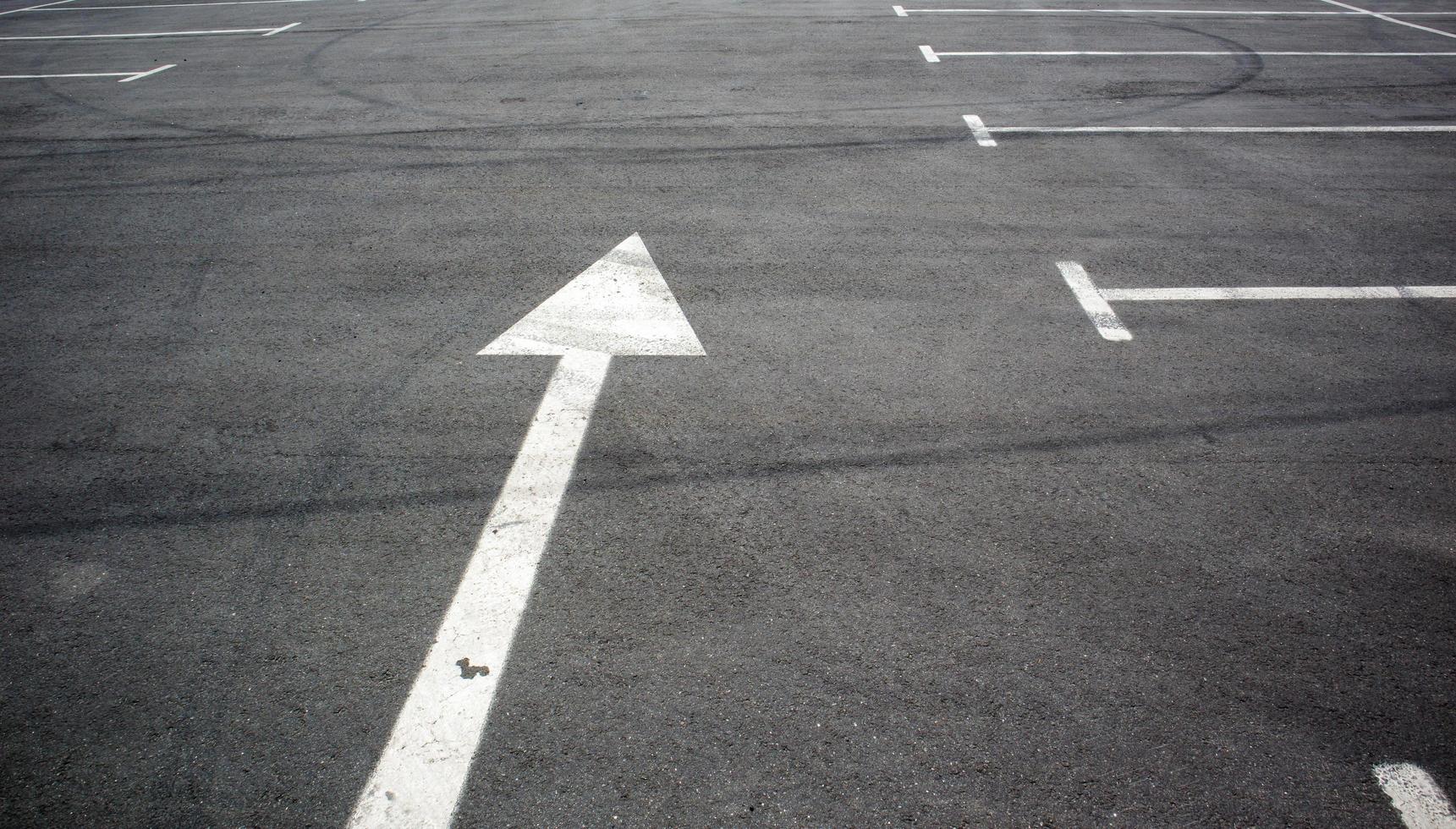 Parking kiosks in the parking lot, marked with white lines. Empty parking lot. Outdoor car park with freshly painted kiosk lines. Outdoor parking on an asphalt road. photo