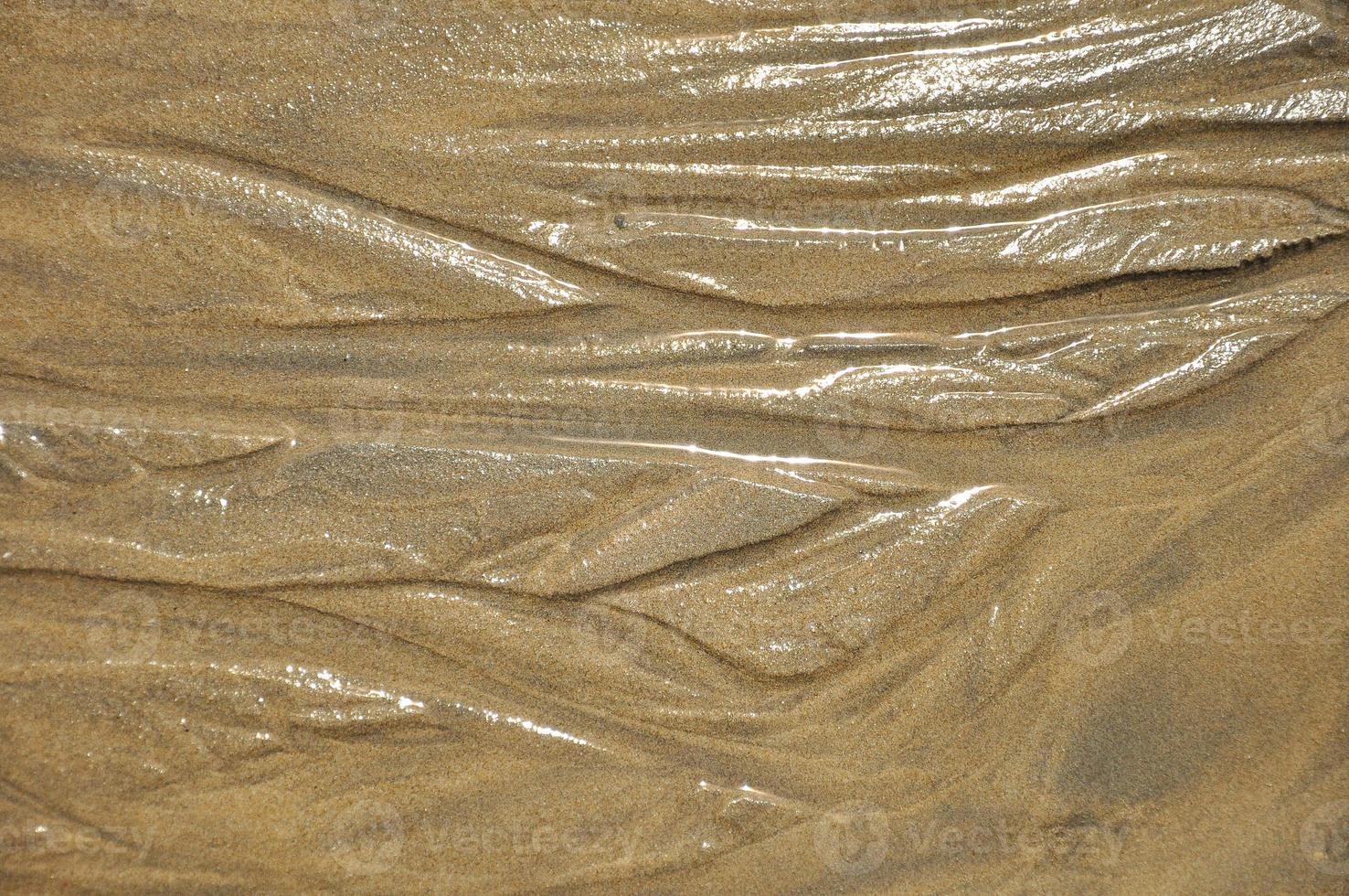 Wet sand with lines photo