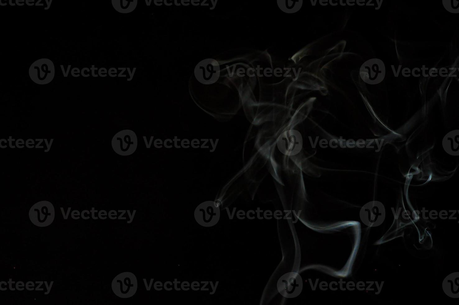 White smoke on a black background photo