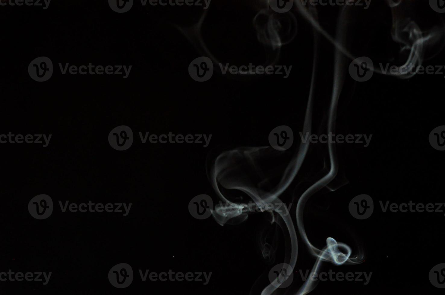 White smoke on a black background photo