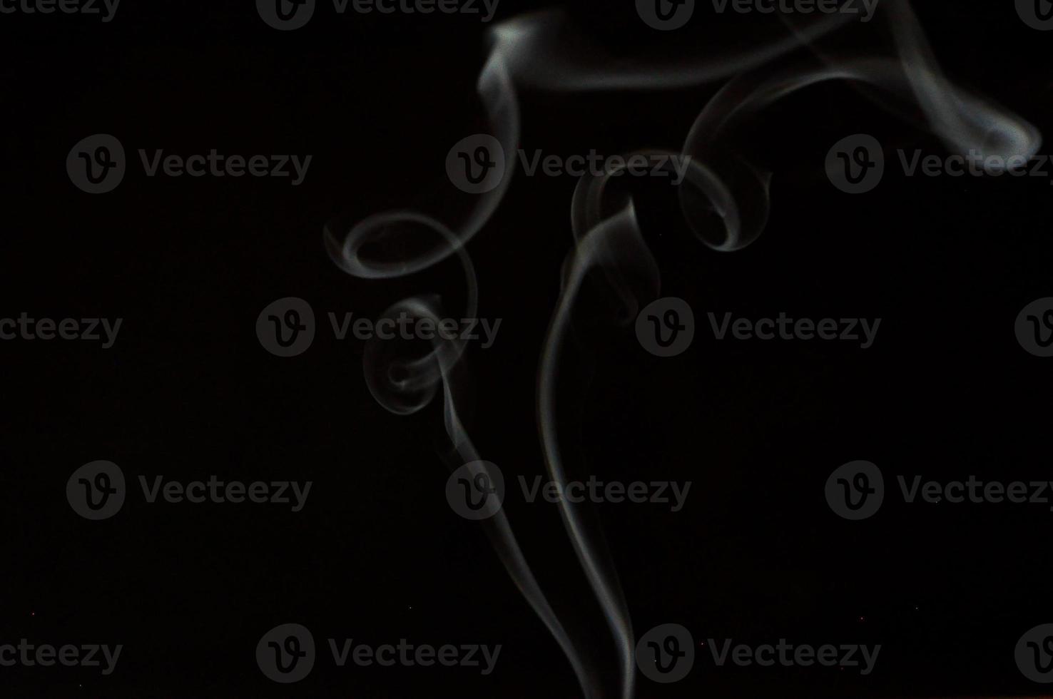 White smoke on a black background photo