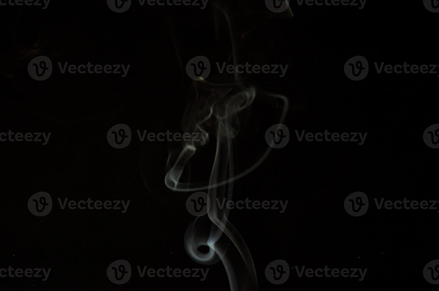 White smoke on a black background photo