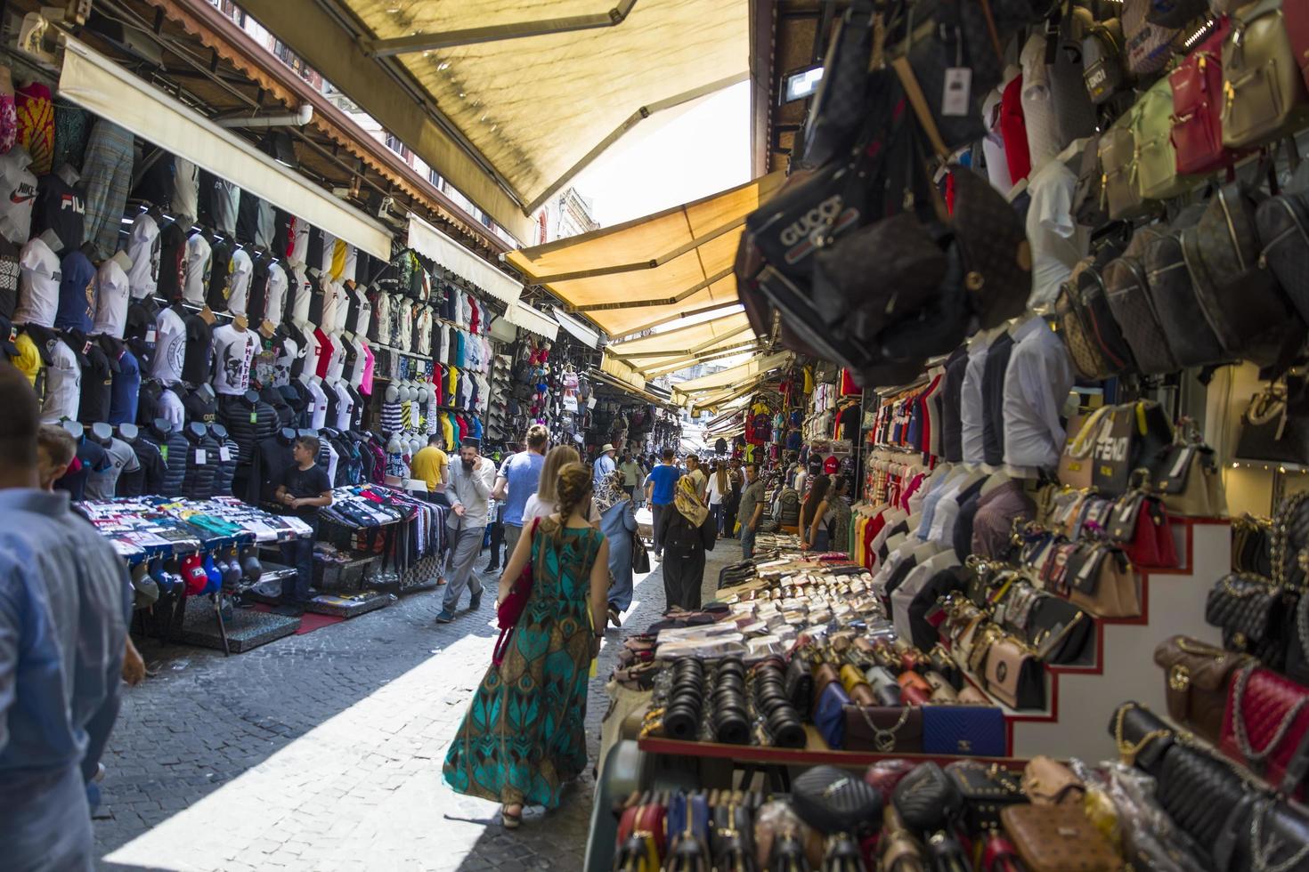 ISTANBUL, TURKEY, JUNE 18, 2019 - Unidentified people at Grand Bazaar in Istanbul, Turkey. Grand Bazaar in Istanbul is one of the largest and oldest covered markets in the world. photo