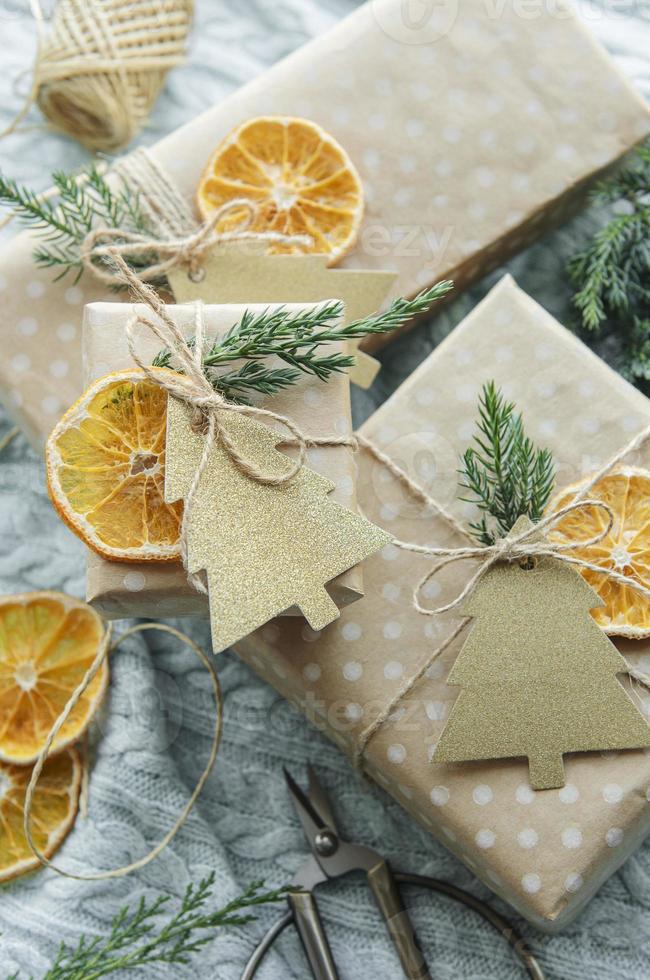 Christmas  decorative homemade gift boxes wrapped in brown kraft paper photo