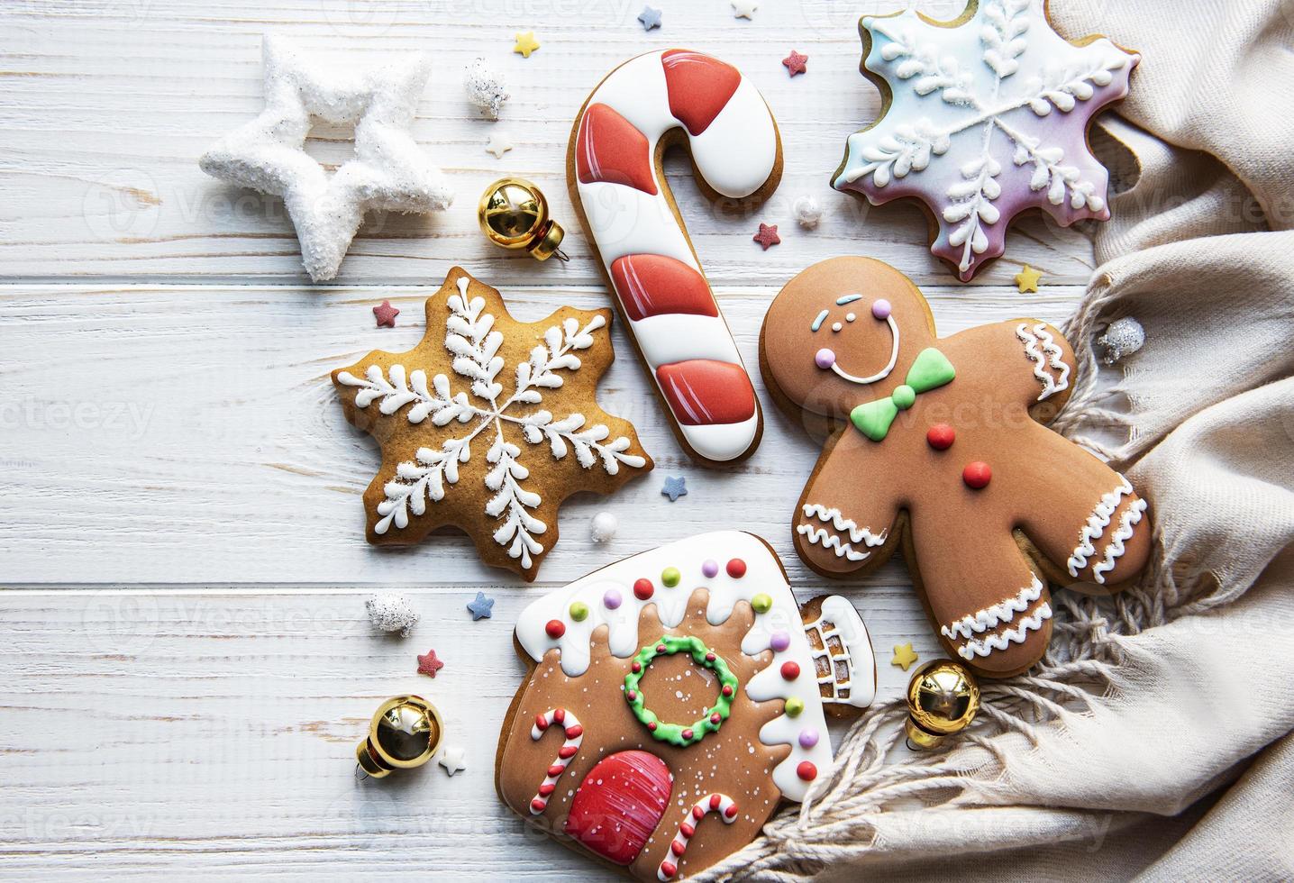 Christmas gingerbread with christmas decorations on white wooden table photo