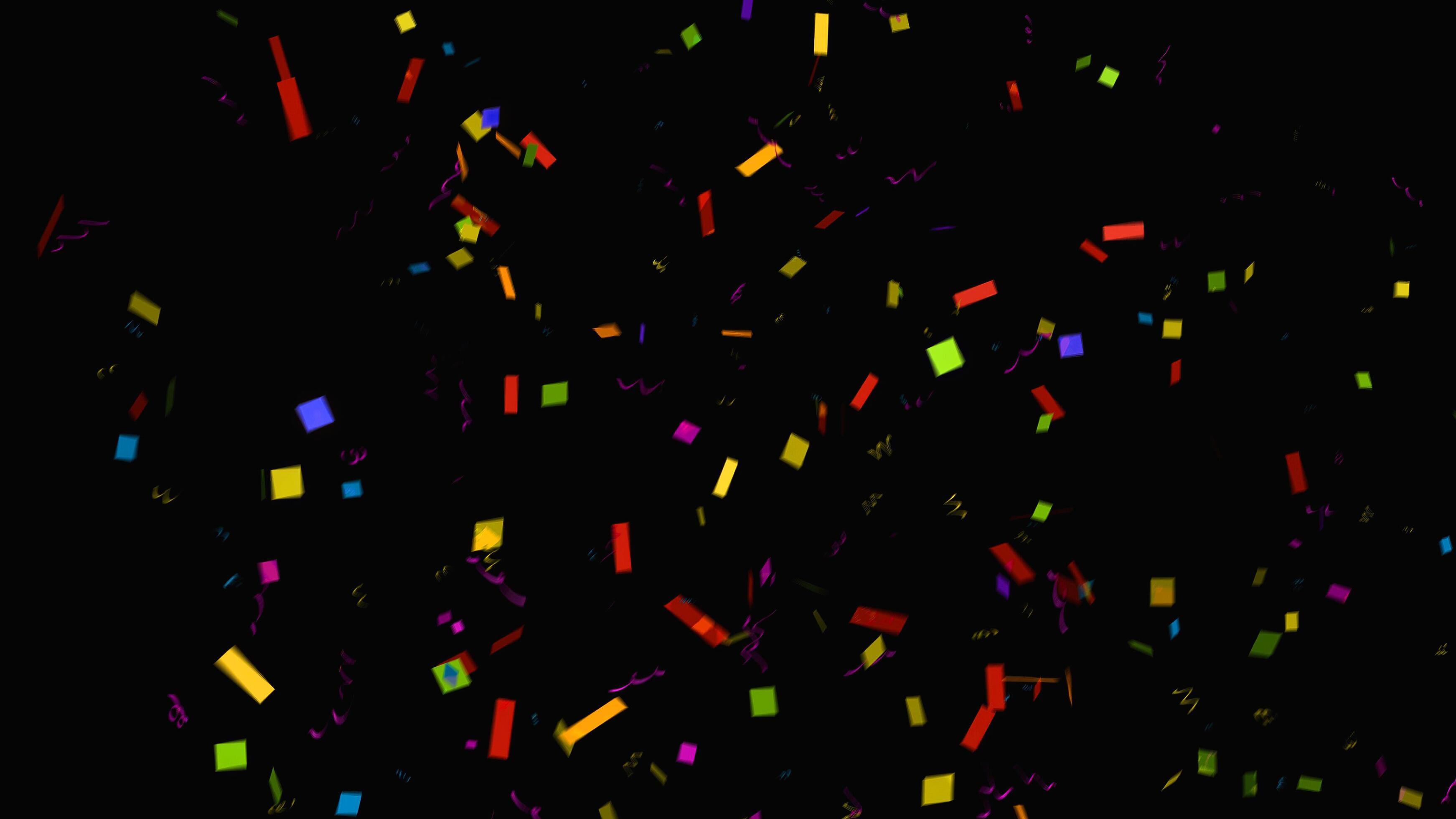 Colorful rainbow glitter / confetti rhombuses on a black background, top  view. Perfect for carnival, night pa…