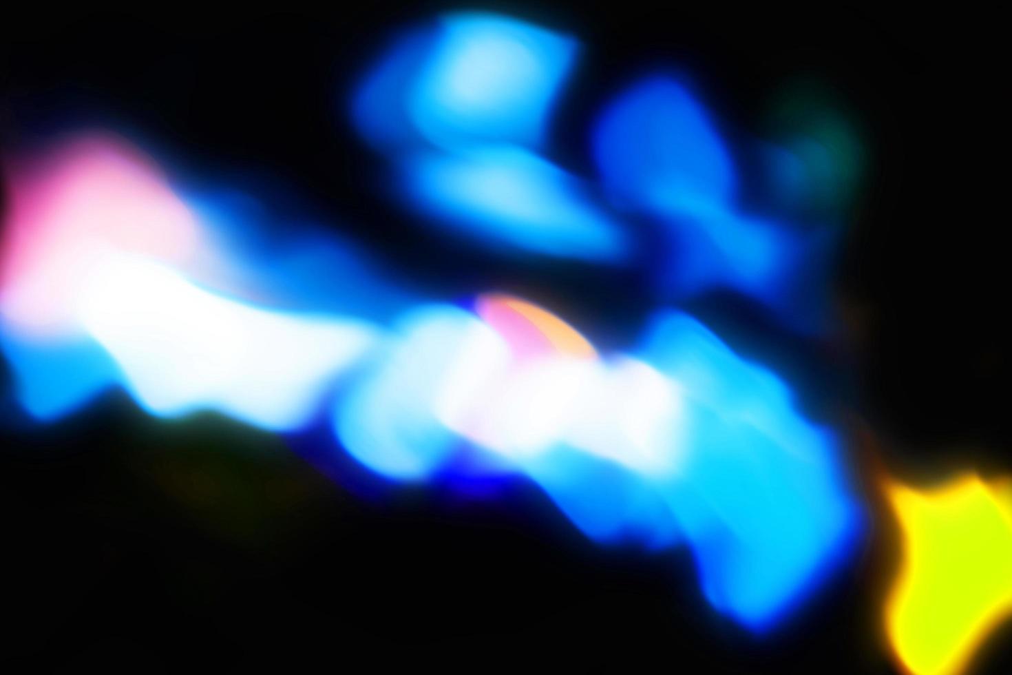 light blue abstract magic blur light texture rainbow reflective on black. photo