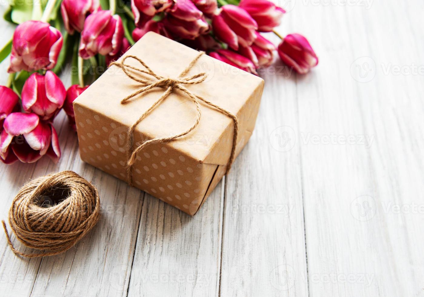 Gift box and tulips bouquet photo