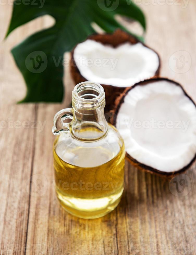 Bottle with coconut oil photo