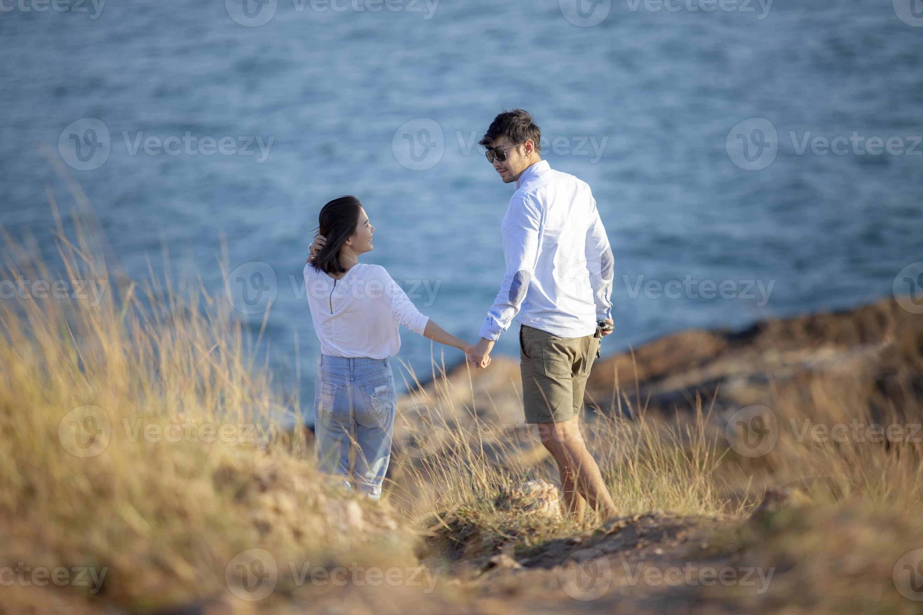 younger couples relaxing happiness emotion at vacation seaside photo