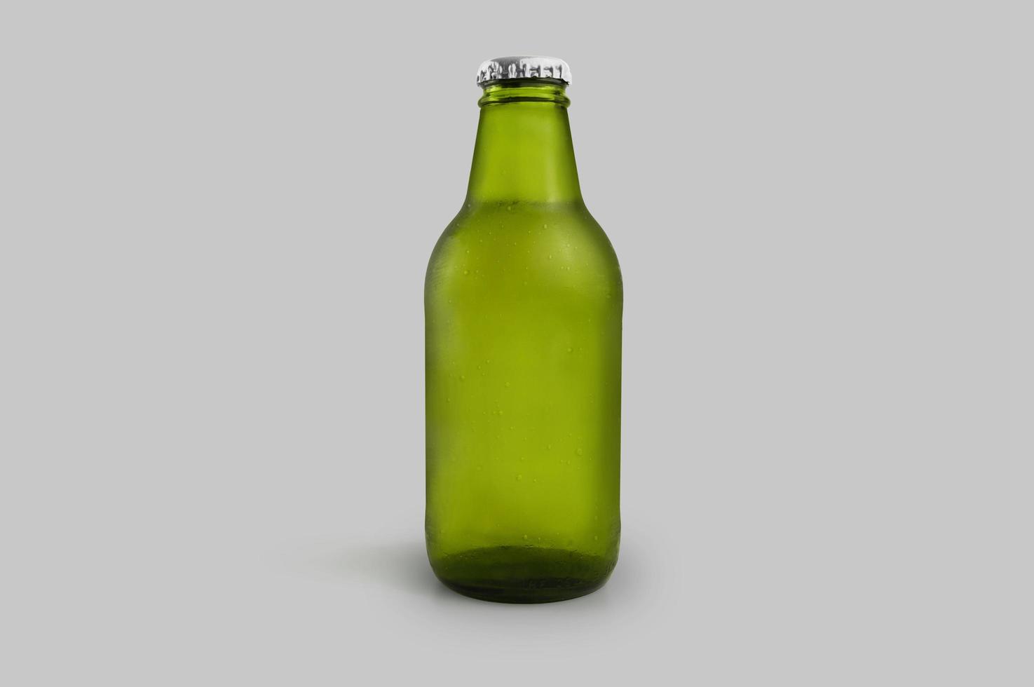 Cold green beer bottle isolated photo