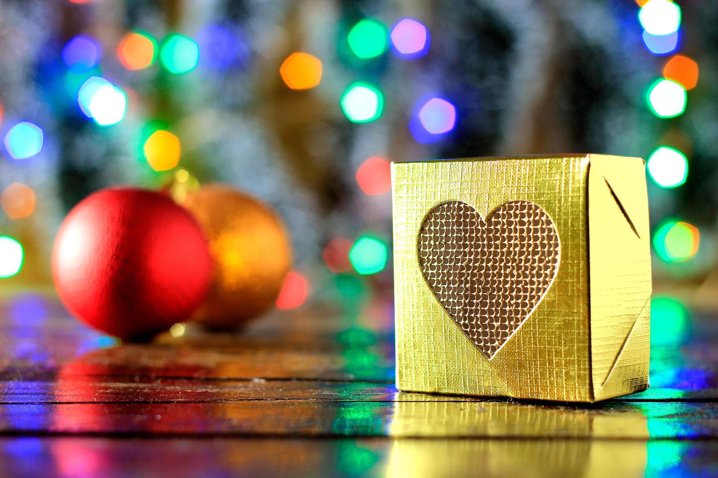 gift boxes on wooden table, christmas decoration, blurred lights photo