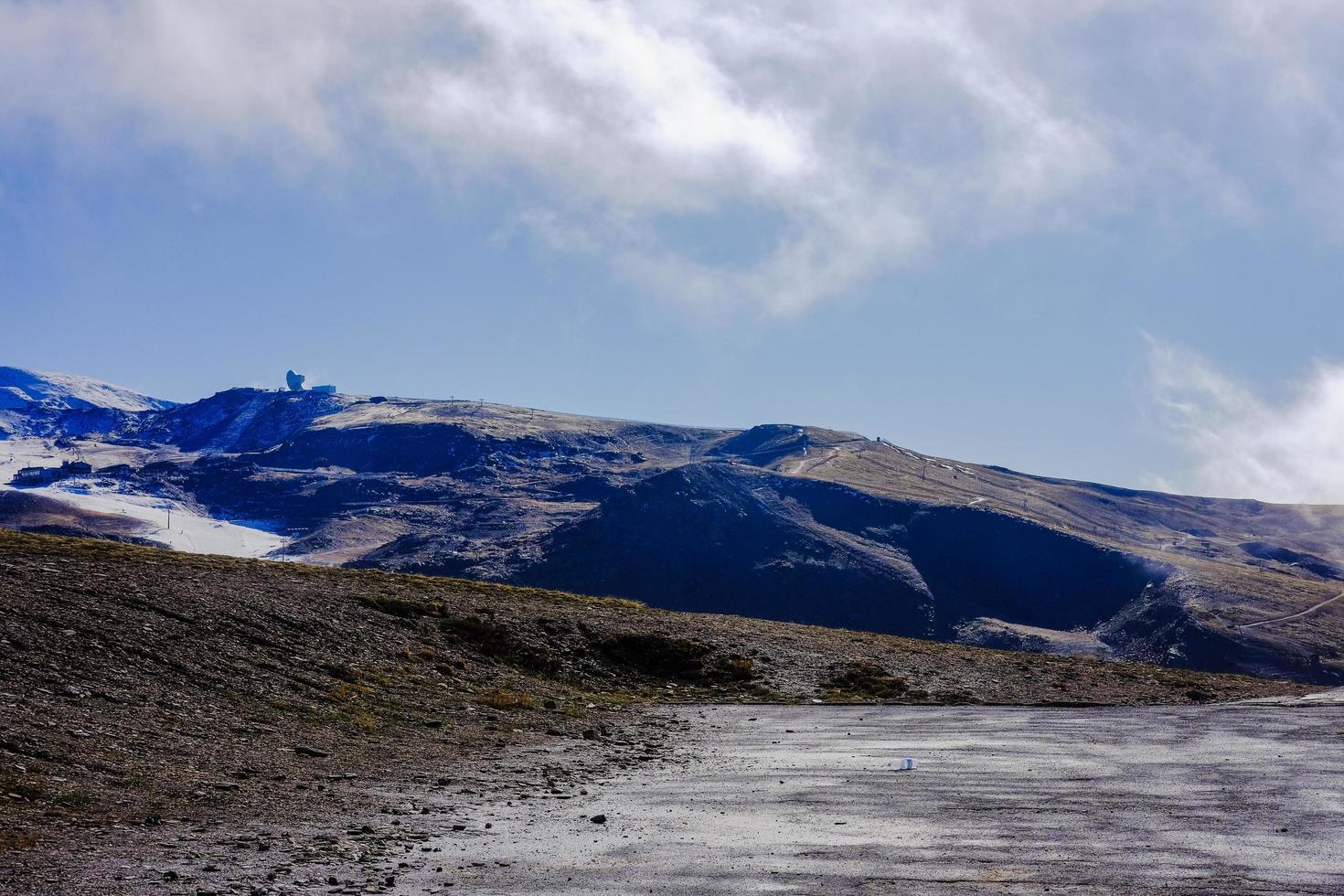 Beautiful landscape snow covered mountains and blue sky photo