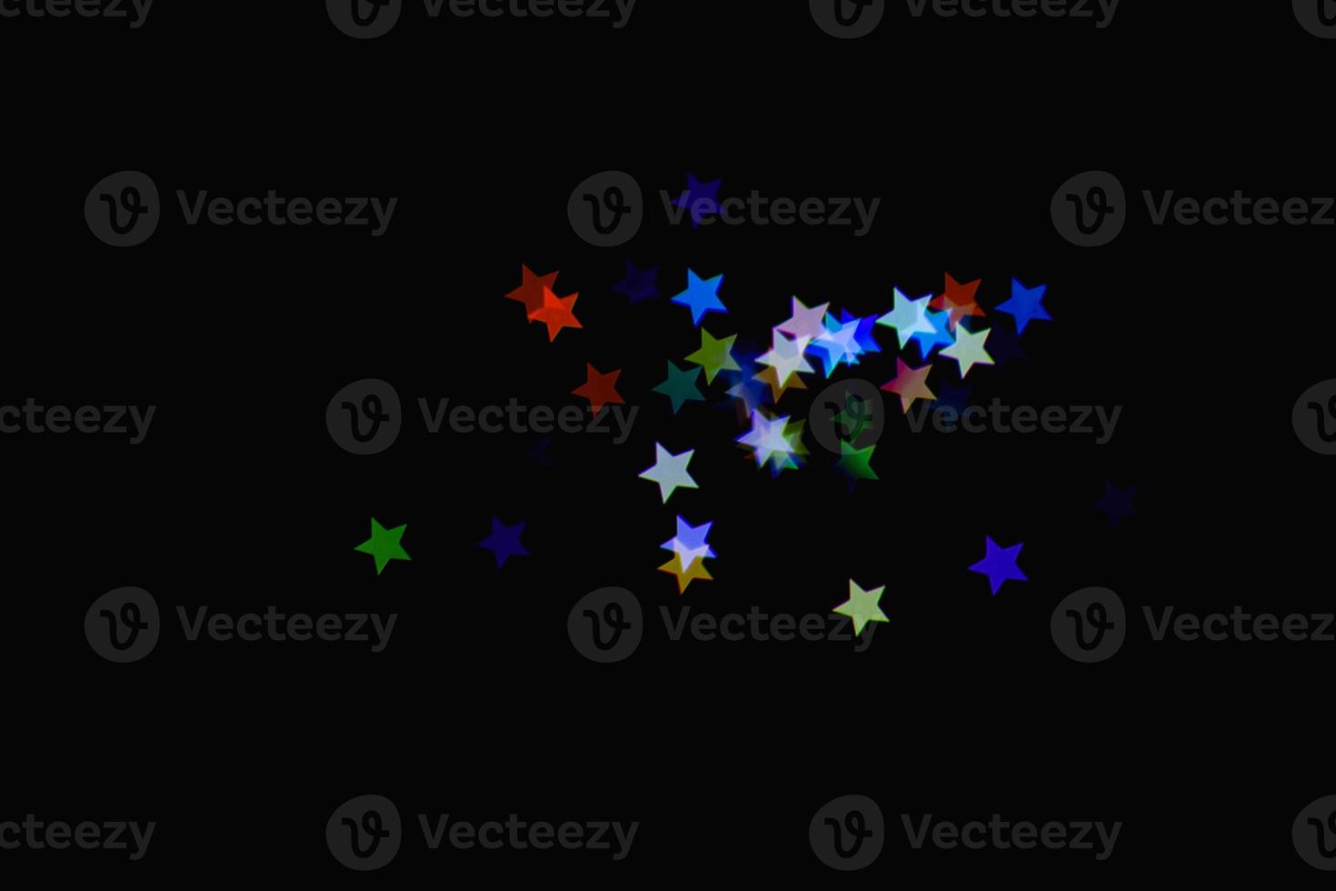 light colorful blue star little effect isolated overlay glitter texture on black. photo