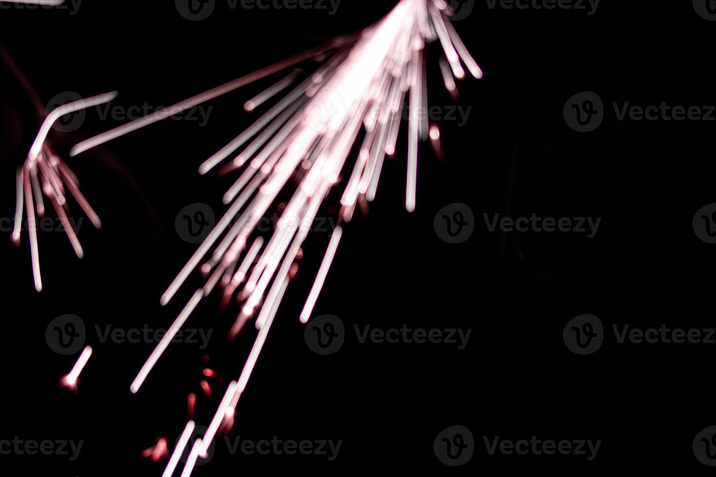 abstract lite red sparkler overlays elegant texture blur sparkling on black. photo