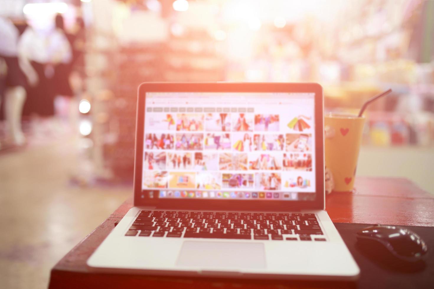 laptop desktop shopping online and mall blurred backgrounds. photo