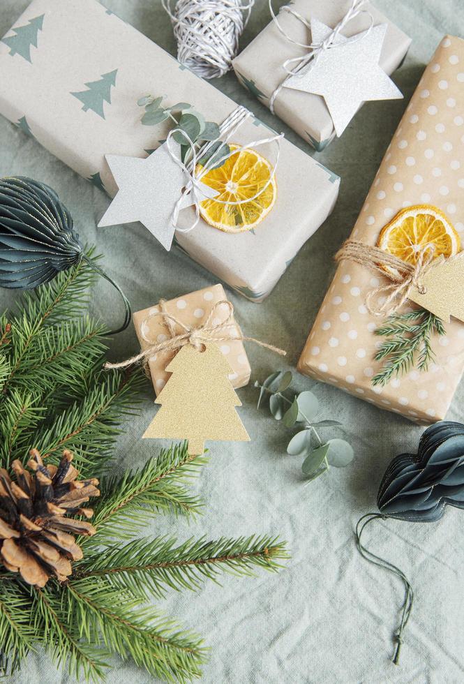 Christmas  decorative homemade gift boxes wrapped in brown kraft paper photo